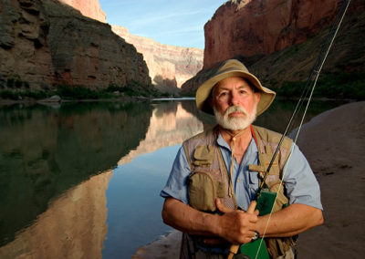 portrait of fisherman next to Colorado River in Grand Canyon