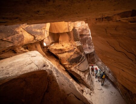 group of rafters slot canyon hiking Cataract canyon