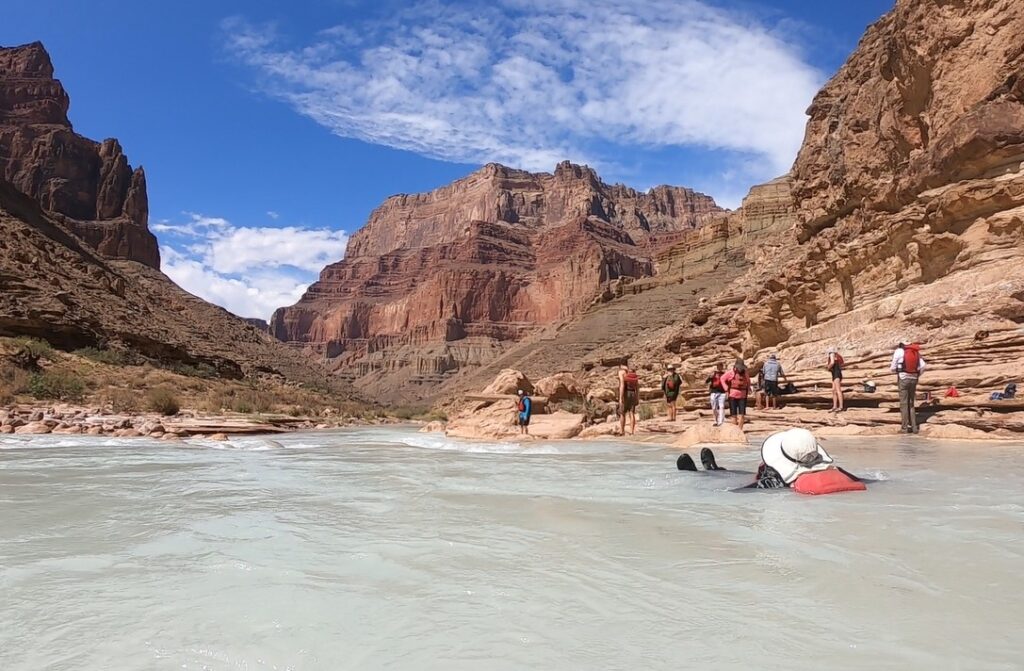 Woman swimming rapid on Little Colorado River