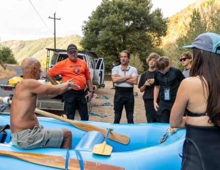 Guide discussing how to stay in a raft on cherry Creek with commercial guests